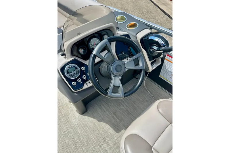 Slide: The Image of 2019 Princecraft Vectra 21 boat dashboard with steering wheel and controls. - 27