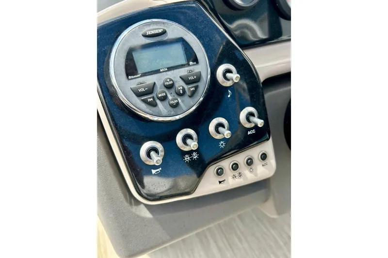 Slide: The Image of Control panel of a 2019 Princecraft Vectra 21 boat with Jensen audio system. - 28