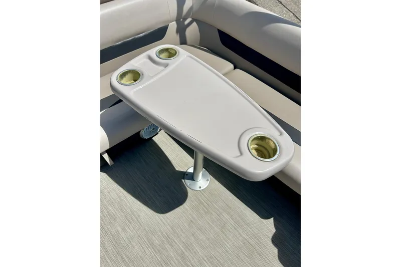 Slide: The Image of 2019 Princecraft Vectra 21 boat interior with table and cup holders. - 32