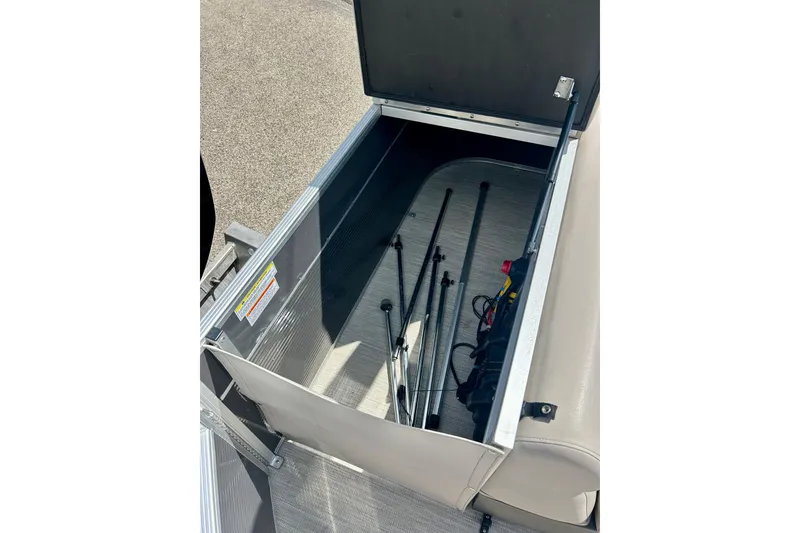 Slide: The Image of Open storage compartment in 2019 Princecraft Vectra 21 boat, containing fishing rods and equipment. - 41