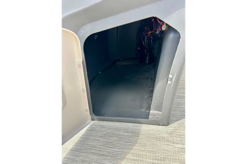 Slide: The Image of Storage compartment of a 2019 Princecraft Vectra 21 boat, showing interior wiring. - 48