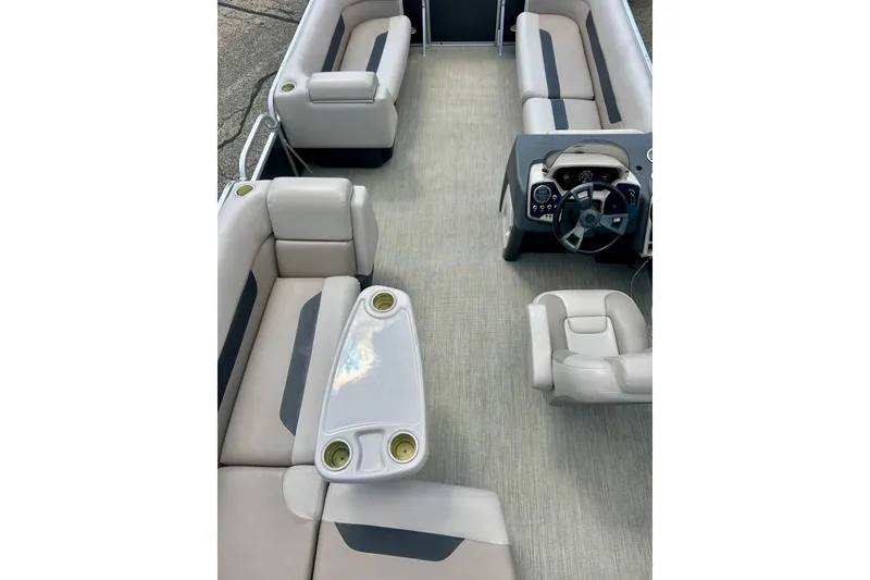 Slide: The Image of 2019 Princecraft Vectra 21 pontoon boat interior with plush seating and steering console. - 50