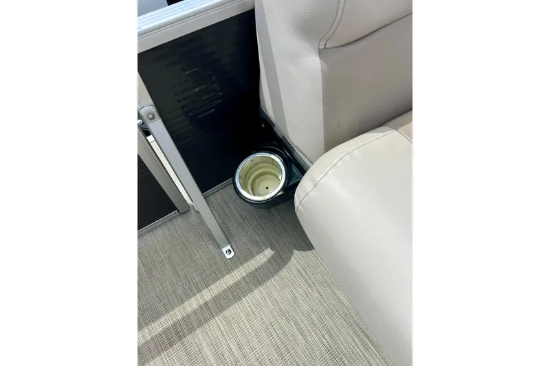 Slide: The Image of 2019 Princecraft Vectra 21 boat interior with beige seating and built-in cup holder. - 51
