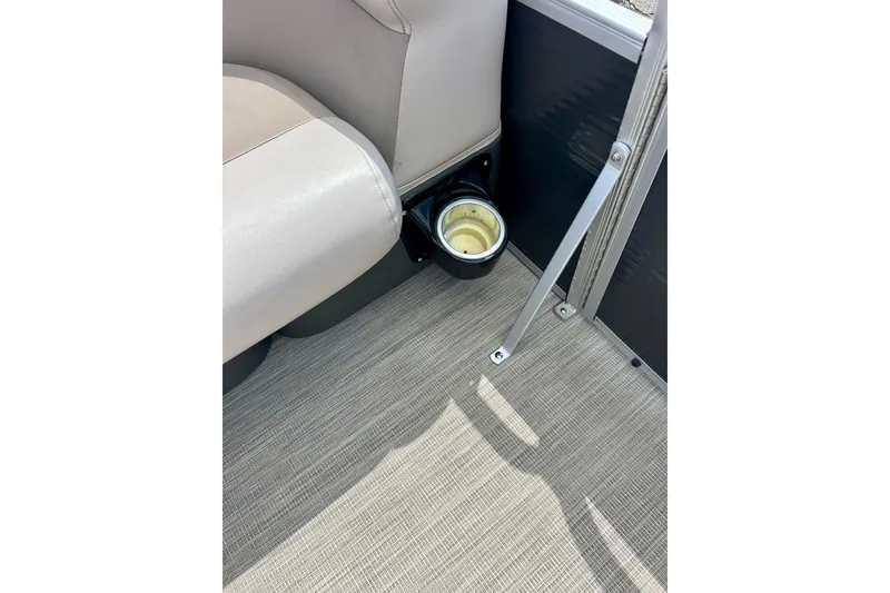 Slide: The Image of 2019 Princecraft Vectra 21 boat interior with beige seating and cup holder. - 52