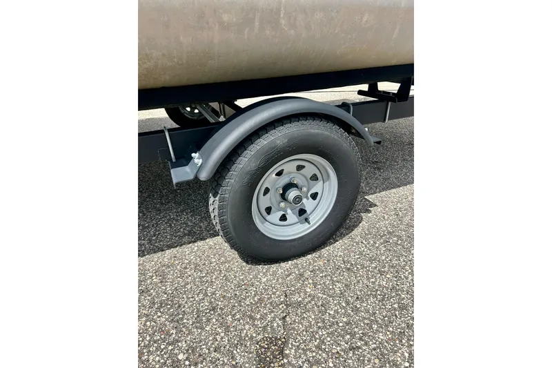 Slide: The Image of Trailer wheel of a 2019 Princecraft Vectra 21 boat on asphalt surface. - 53