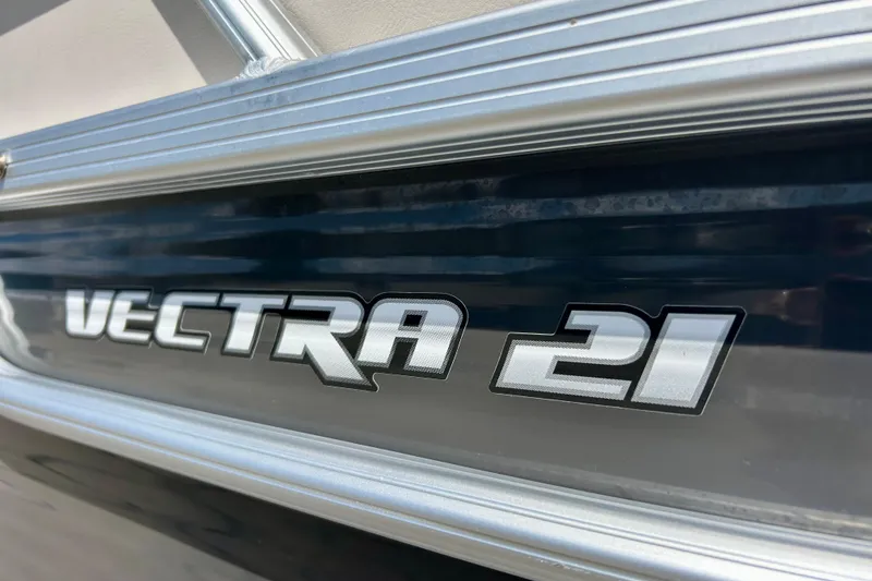 Slide: The Image of Close-up of 2019 Princecraft Vectra 21 boat logo on metallic surface. - 6