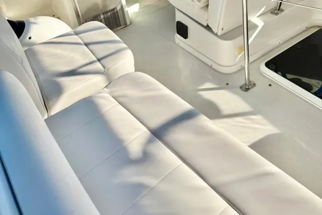 Slide: The Image of Interior of a 1998 Carver 350 Mariner yacht with white seating and flooring. - 14