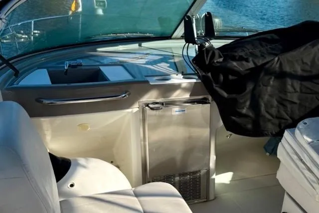 Slide: The Image of Interior view of a 1998 Carver 350 Mariner yacht cockpit with seating and equipment. - 16