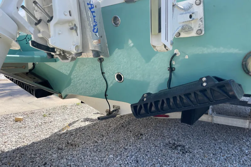 Slide: The Image of 2017 Everglades 243 Center Console boat underside with trim tabs and motor mount. - 5