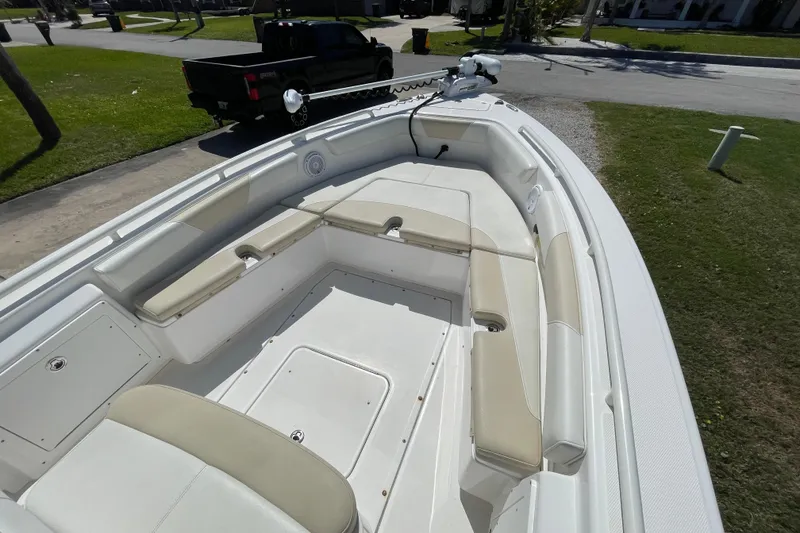 Slide: The Image of 2017 Everglades 243 Center Console boat with spacious seating and clean deck. - 6