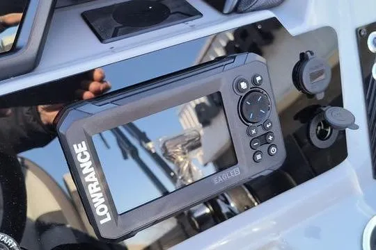 Slide: The Image of Lowrance marine device on Viaggio X22S 2026 dashboard, featuring control buttons and display. - 6