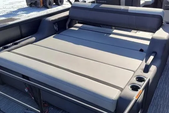 Slide: The Image of 2026 Viaggio X22S boat interior with spacious seating and cup holders. - 8