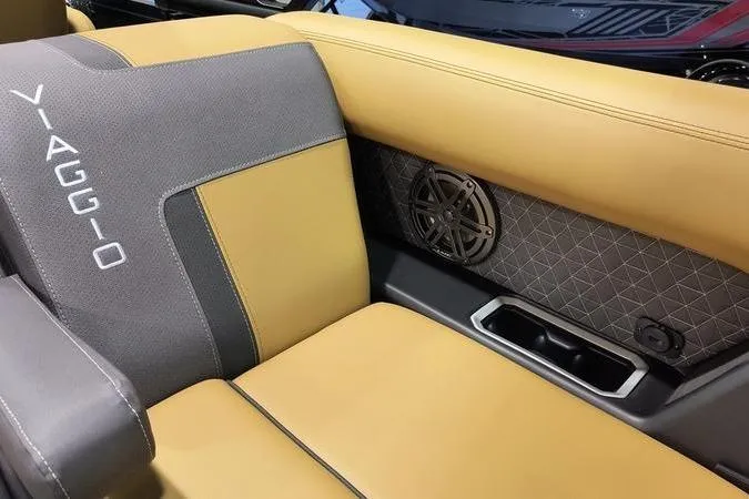 Slide: The Image of 2026 Viaggio Z22U interior with tan and gray leather seats, featuring stylish stitching and speaker detail. - 12