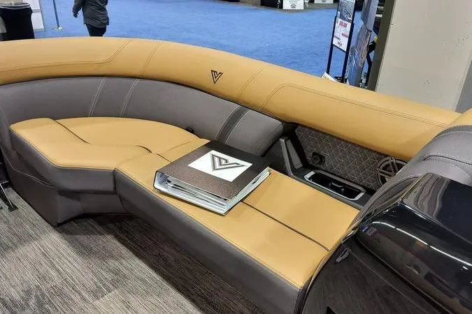 Slide: The Image of Luxurious Viaggio Z22U 2026 boat seating with tan and gray upholstery at a trade show. - 16