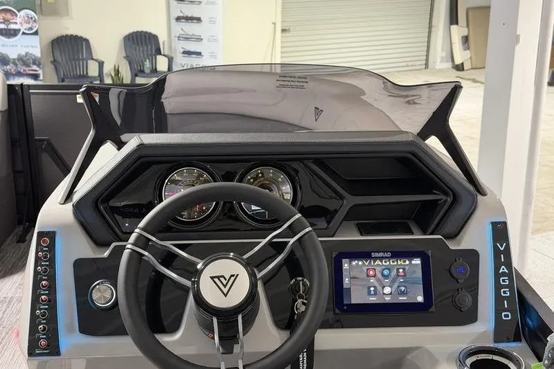 Slide: The Image of 2026 Viaggio Z22S boat dashboard with steering wheel, gauges, and digital display. - 11