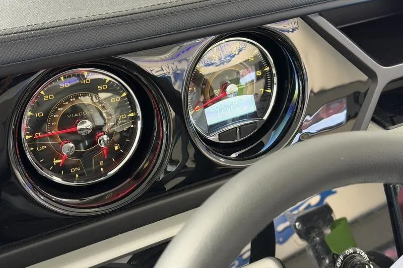 Slide: The Image of Dashboard of 2026 Viaggio Z22S with analog gauges and digital display. - 12