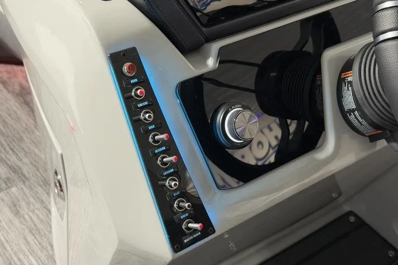 Slide: The Image of Control panel of 2026 Viaggio Z22S boat with switches and audio knob. - 13