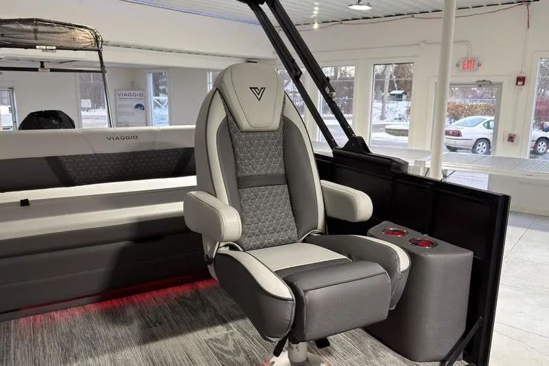 Slide: The Image of Luxurious Viaggio Z22S 2026 boat seat with modern design and cup holders in showroom. - 15