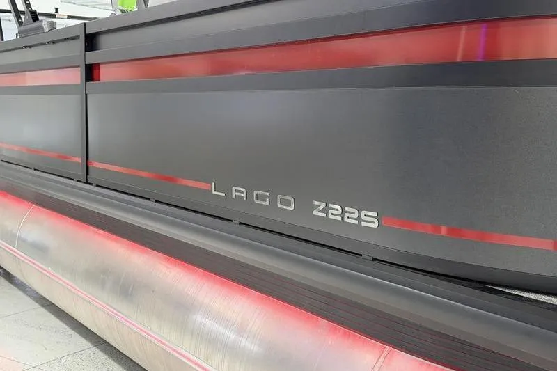 Slide: The Image of 2026 Viaggio Z22S boat with sleek black and red design details. - 2