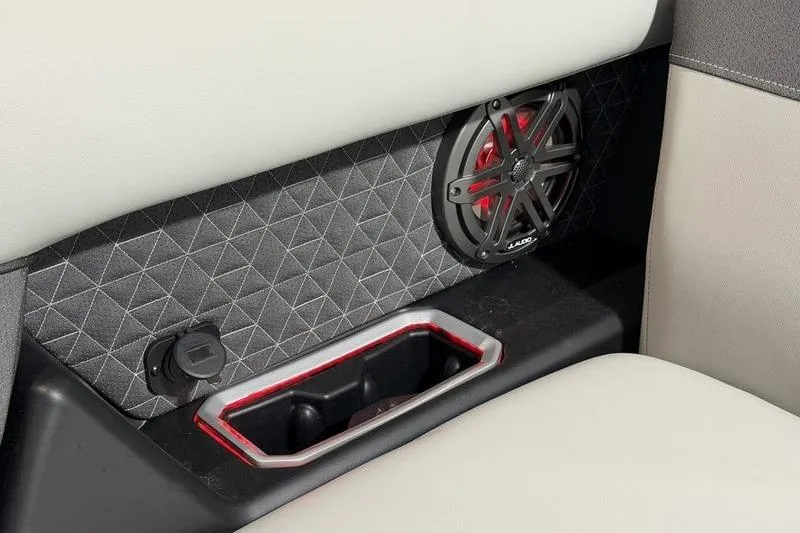 Slide: The Image of Interior of 2026 Viaggio Z22S featuring speaker and cup holder with modern design. - 9