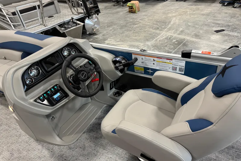 Slide: The Image of Interior of a 2026 Berkshire 24 UL boat, featuring a modern helm and comfortable seating. - 11