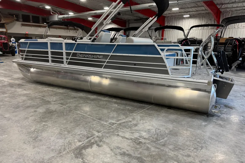 Slide: The Image of 2026 Berkshire 24 UL pontoon boat in a showroom setting. - 4