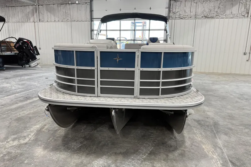 Slide: The Image of 2026 Berkshire 24 UL pontoon boat in a showroom, front view. - 5