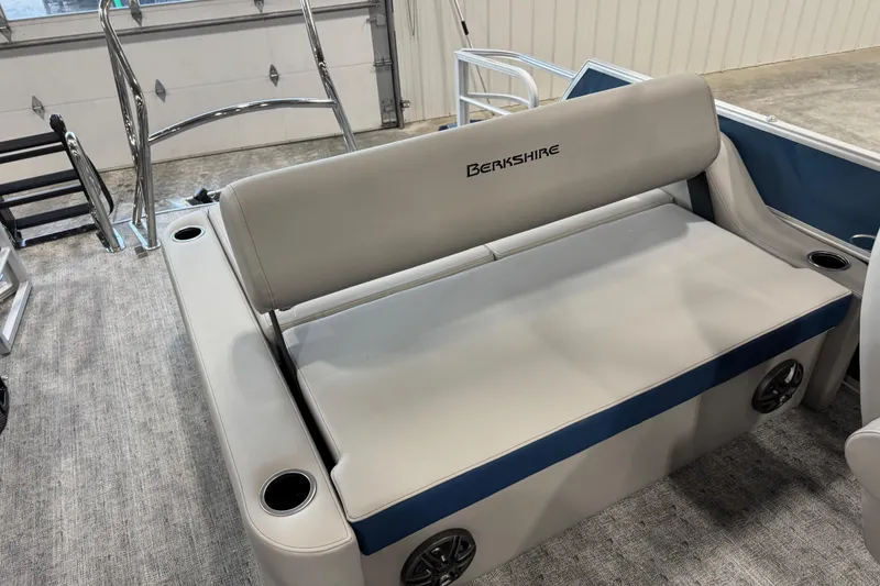 Slide: The Image of 2026 Berkshire 24 UL boat interior with gray seating and cup holders. - 7