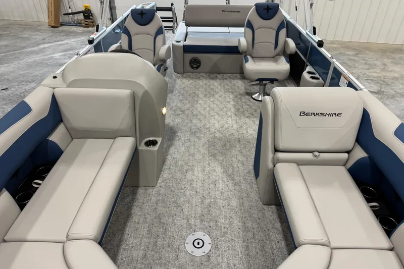 Slide: The Image of 2026 Berkshire 24 UL pontoon boat interior with plush seating and modern design. - 9
