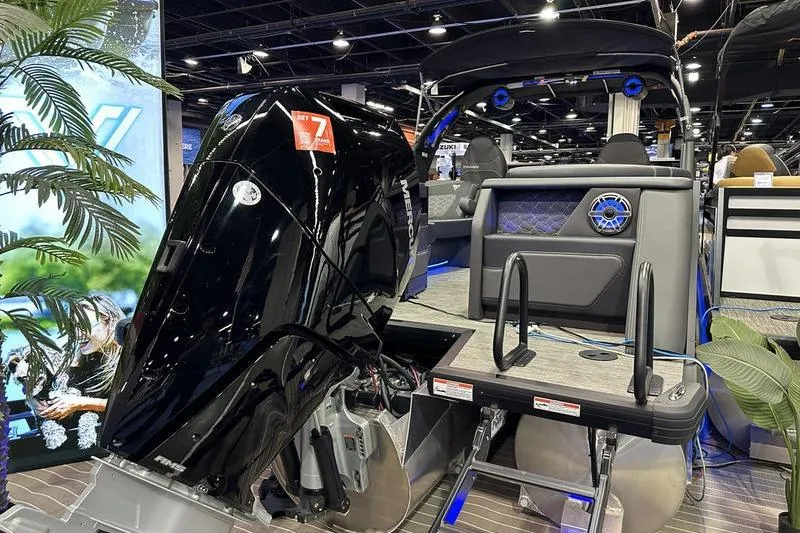 Slide: The Image of Viaggio Diamante UWA 2026 boat with powerful outboard motor at a boat show. - 12