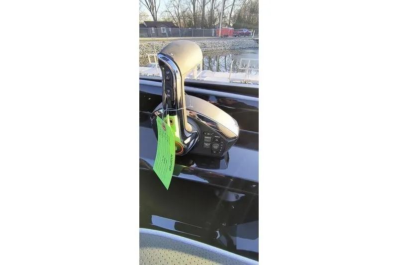 Slide: The Image of Viaggio Diamante UWA 2026 boat throttle control with green tag, reflecting sunlight. - 13