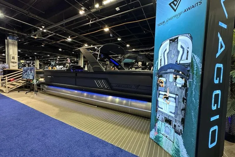 Slide: The Image of 2026 Viaggio Diamante UWA boat displayed indoors with promotional banner. - 5