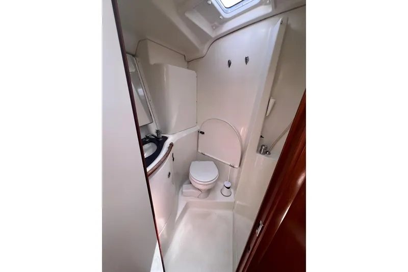 Slide: The Image of Warning and caution labels on a Beneteau Oceanis 473 inverter, emphasizing electrical safety. - 100