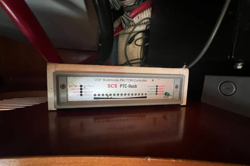 Slide: The Image of Engine compartment of a 2001 Beneteau Oceanis 473 sailboat, showcasing red engine components. - 108