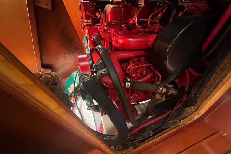 Slide: The Image of Engine compartment of a 2001 Beneteau Oceanis 473 sailboat, showing alternator and wiring. - 114