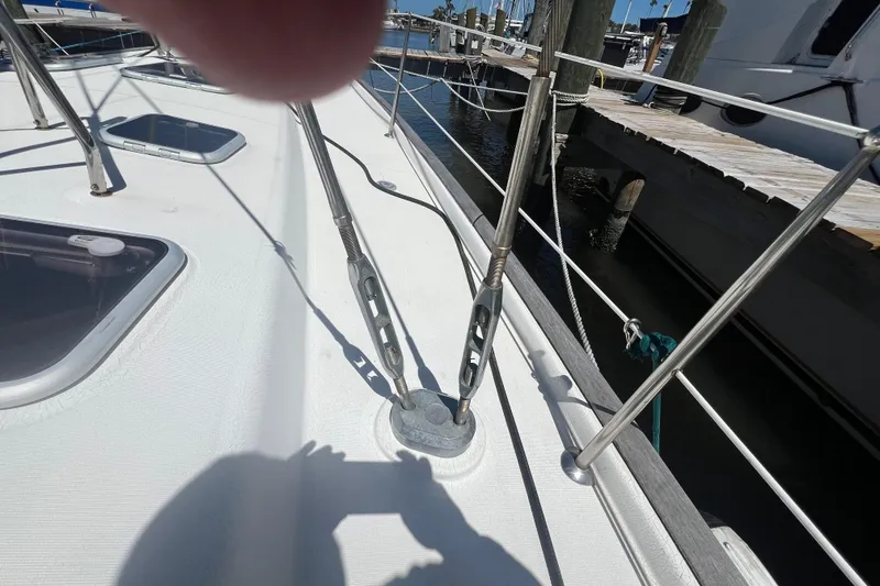 Slide: The Image of Deck view of a 2001 Beneteau Oceanis 473 sailboat with rigging and hatches. - 16