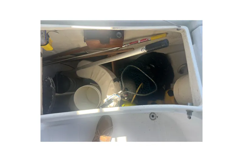 Slide: The Image of Storage compartment of a 2001 Beneteau Oceanis 473 sailboat with coiled cables and equipment. - 41