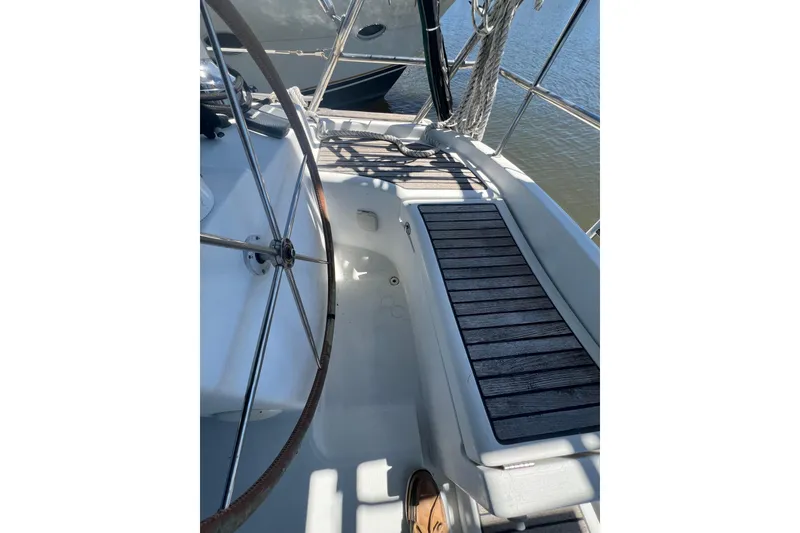 Slide: The Image of Beneteau Oceanis 473 sailboat docked in a marina, 2001 model, sunny day. - 43