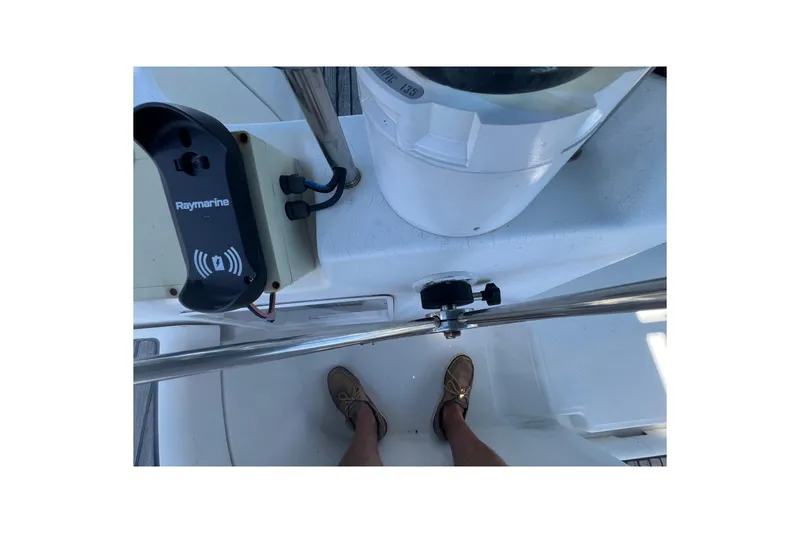 Slide: The Image of Cockpit of 2001 Beneteau Oceanis 473 sailboat with navigation equipment and steering wheel. - 52