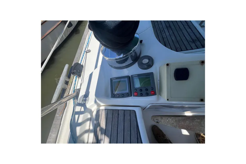 Slide: The Image of Interior of 2001 Beneteau Oceanis 473 yacht with cozy seating and wooden finishes. - 53