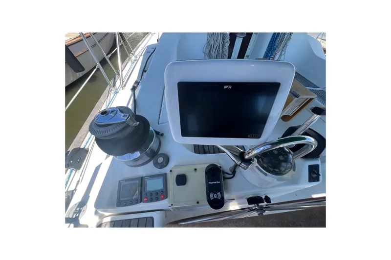 Slide: The Image of Interior of 2001 Beneteau Oceanis 473 yacht with cozy seating and wooden table. - 54