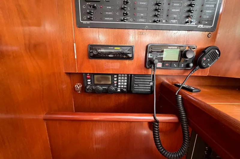 Slide: The Image of Interior of 2001 Beneteau Oceanis 473 sailboat with wooden finish and porthole windows. - 67