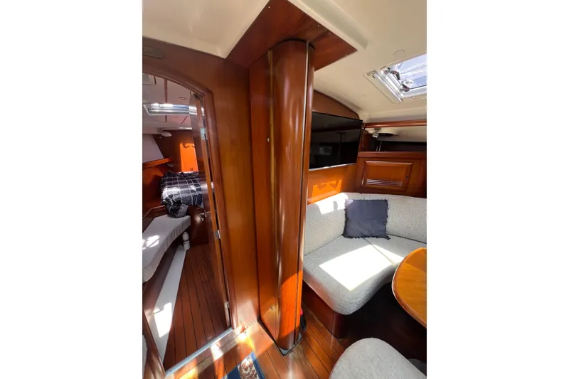 Slide: The Image of Interior cabin of 2001 Beneteau Oceanis 473 sailboat, featuring cozy sleeping area and storage. - 82