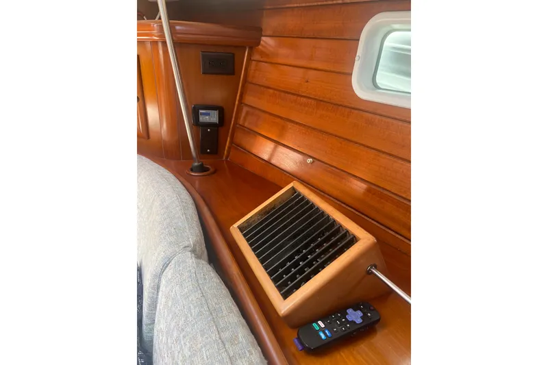 Slide: The Image of Interior of 2001 Beneteau Oceanis 473 yacht showing wooden flooring and control panel. - 83