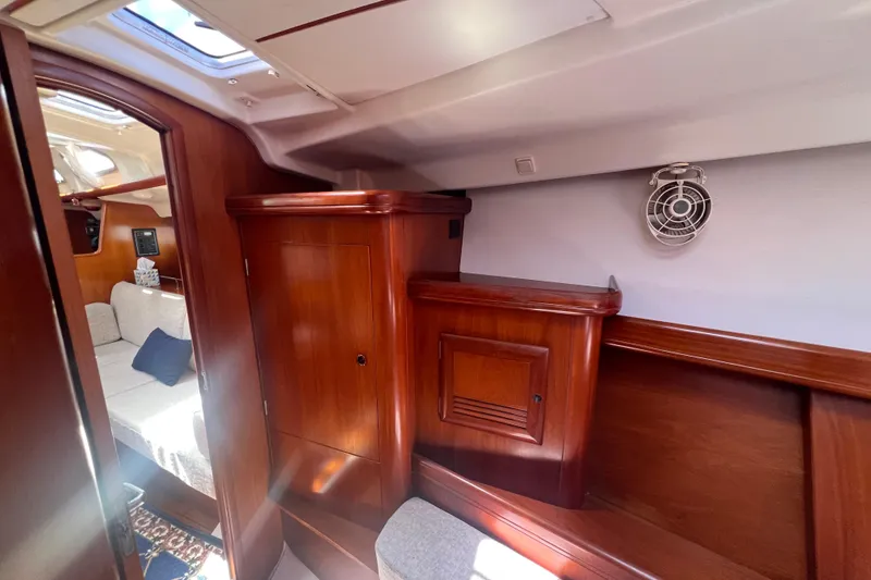 Slide: The Image of Compact bathroom in 2001 Beneteau Oceanis 473 yacht, featuring toilet and shower. - 96