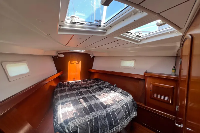 Slide: The Image of Bathroom interior of 2001 Beneteau Oceanis 473 yacht, featuring toilet and sink. - 98