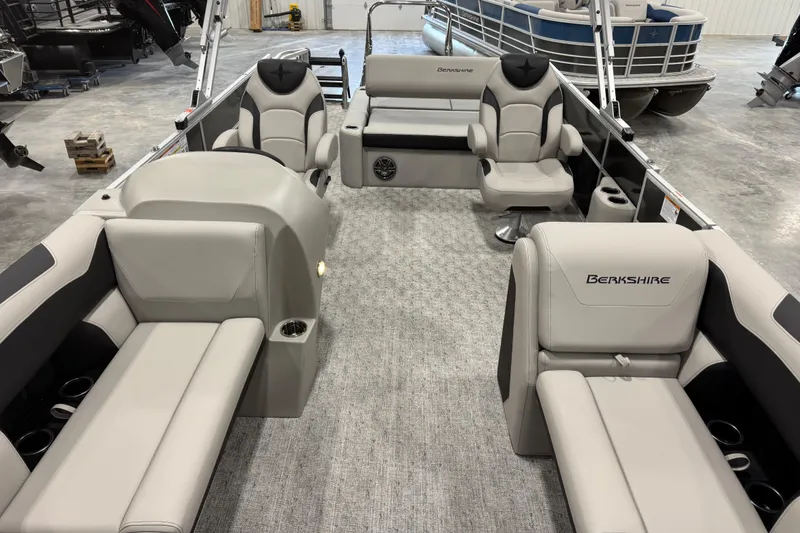 Slide: The Image of 2026 Berkshire 24 UL LE pontoon boat interior with luxurious seating and modern design. - 10