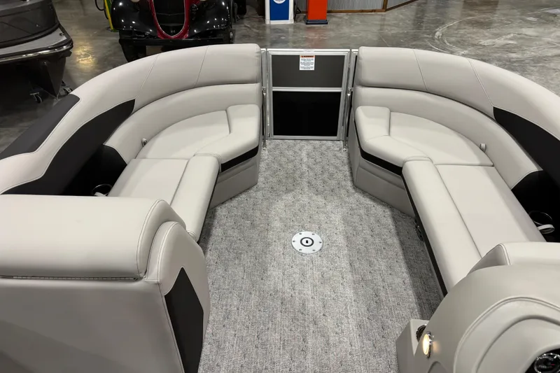 Slide: The Image of 2026 Berkshire 24 UL LE pontoon boat interior with plush seating and modern design. - 12
