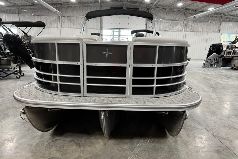 Slide: The Image of 2026 Berkshire 24 UL LE pontoon boat in a showroom, front view. - 4