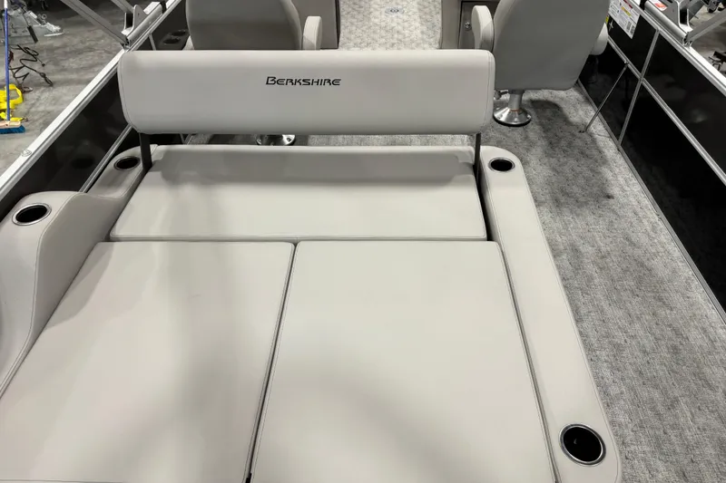 Slide: The Image of 2026 Berkshire 24 UL LE boat interior with gray seating and cup holders. - 7